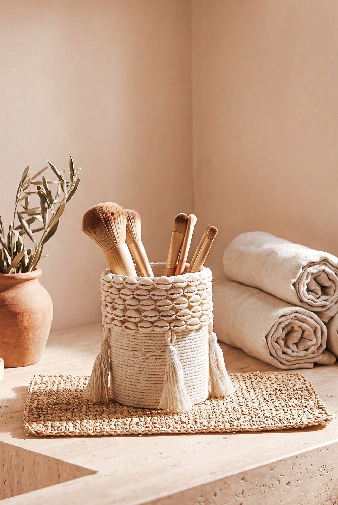 Ibizamode small handcrafted basket with shell details in bohemian bathroom interior