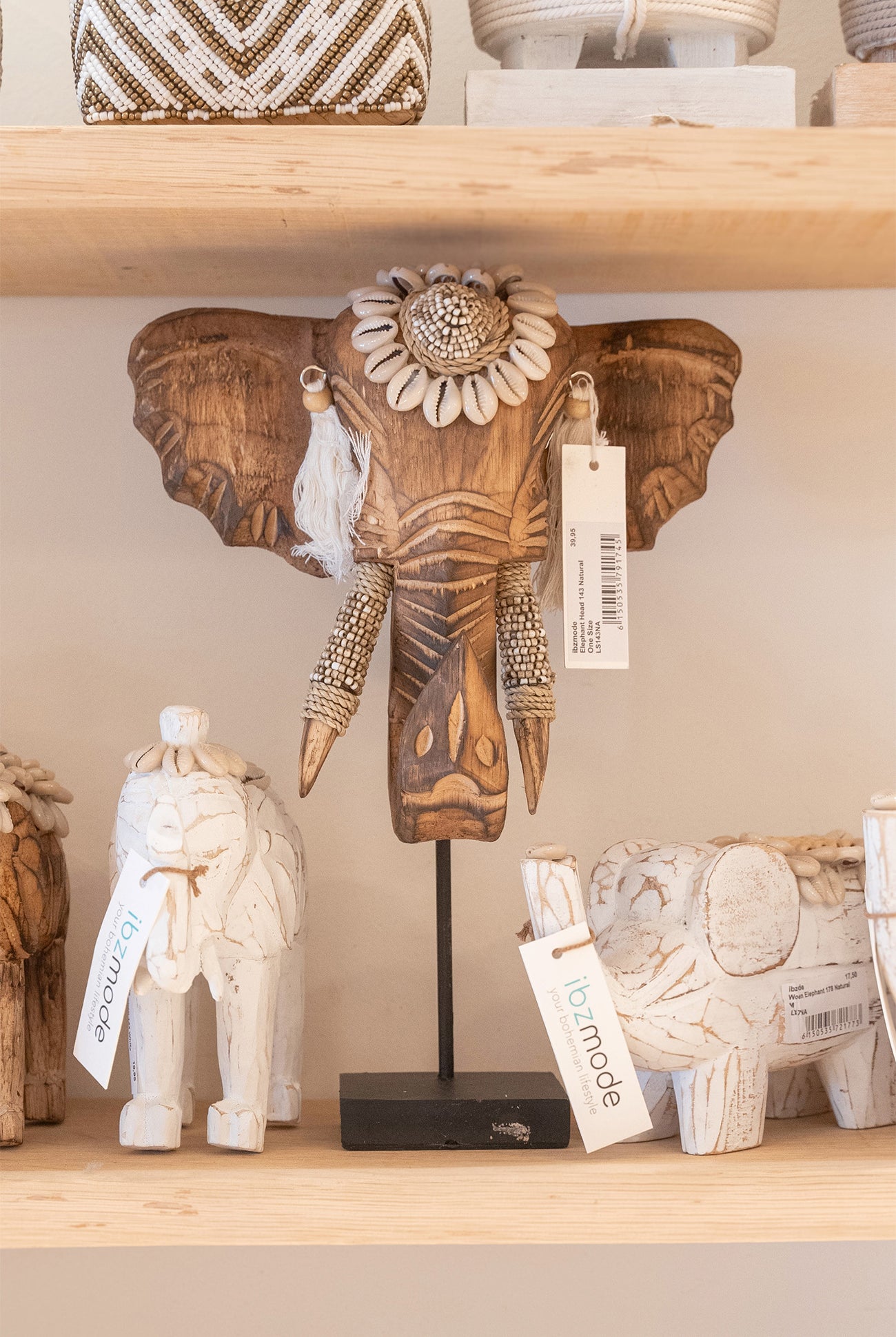 Ibizamode handcrafted wooden elephant decor with shells and tassels in bohemian interior