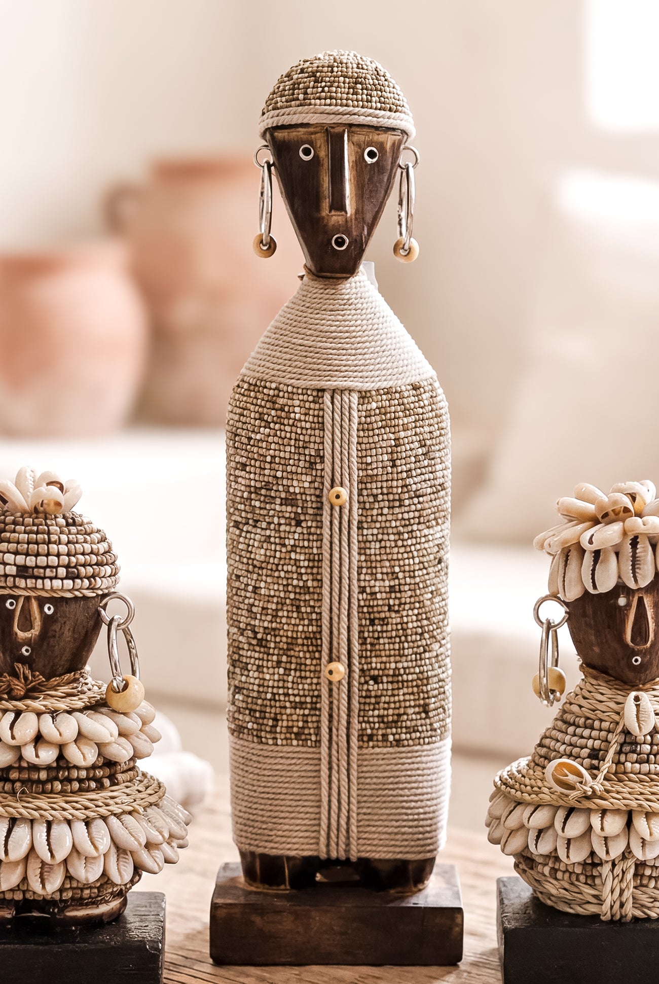 Ibizamode handcrafted nomad beaded doll in natural bohemian interior styling