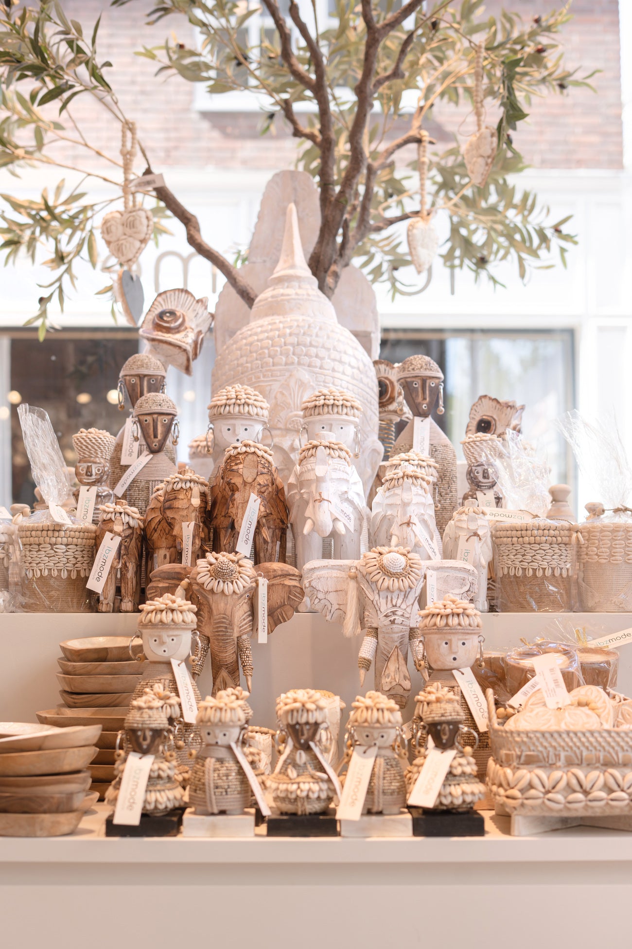Ibizamode handcrafted white wooden elephant decor with shells and tassels in bohemian interior