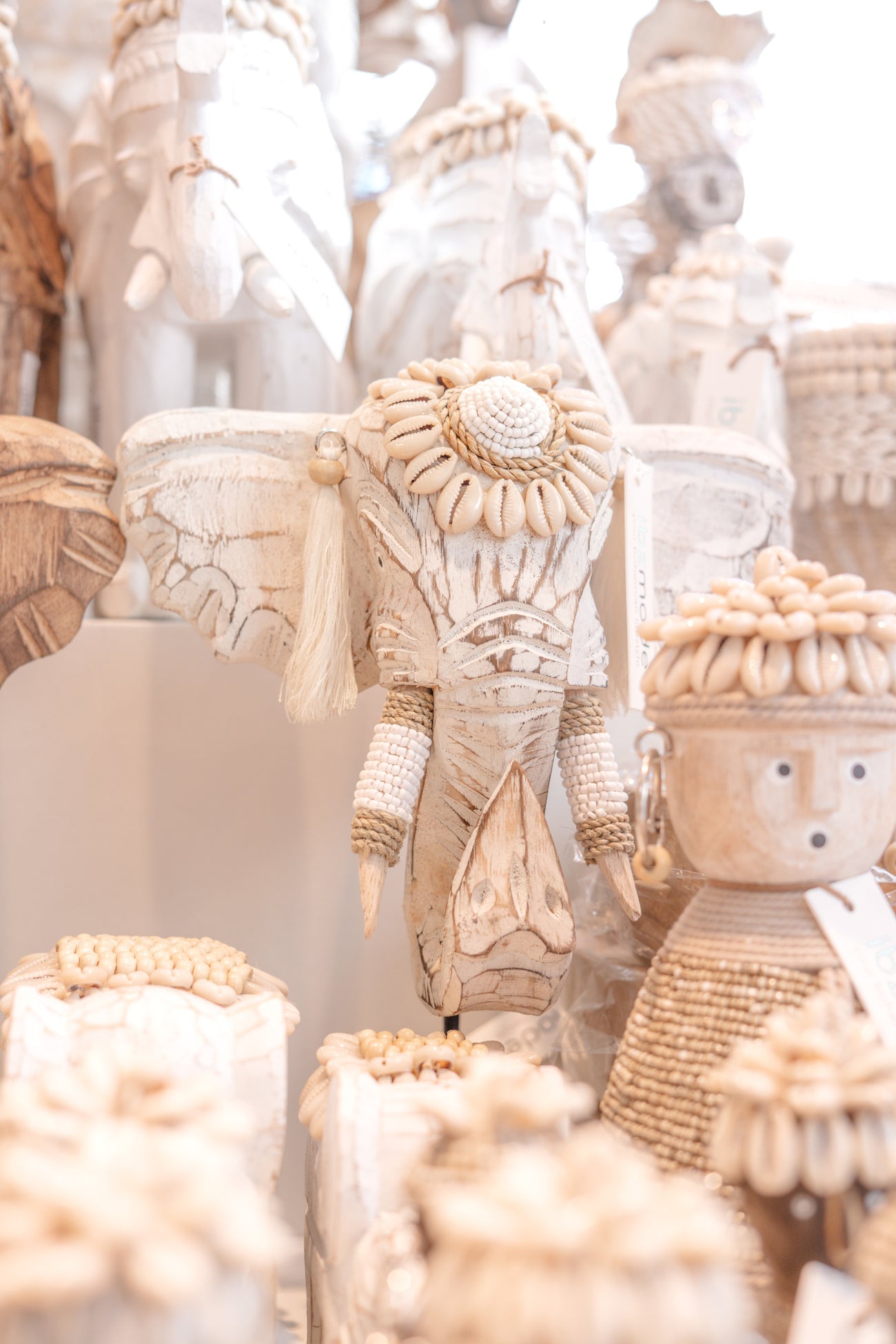 Ibizamode handcrafted white wooden elephant decor with shells and tassels in bohemian interior