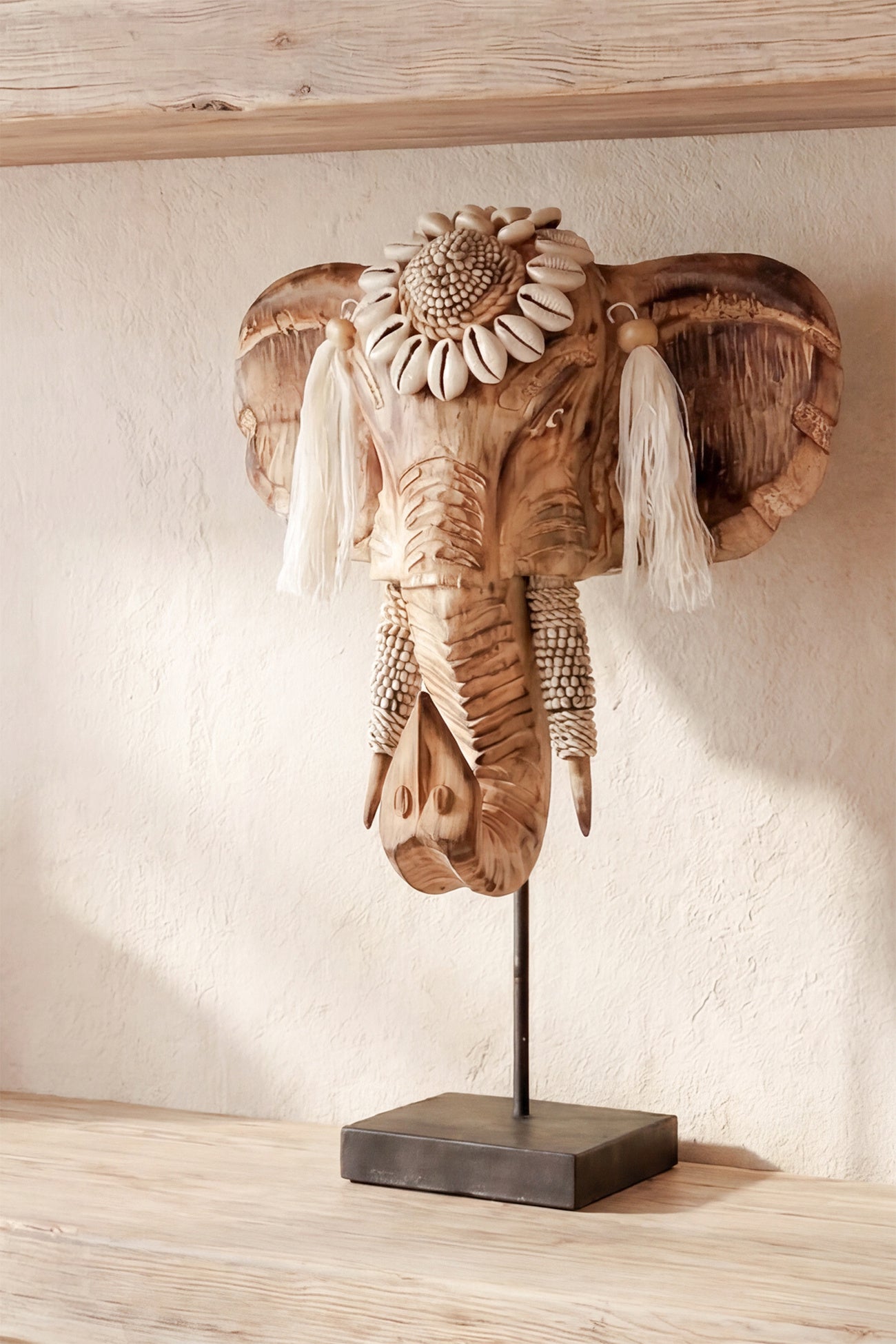 Ibizamode handcrafted wooden elephant decor with shells and tassels in bohemian interior