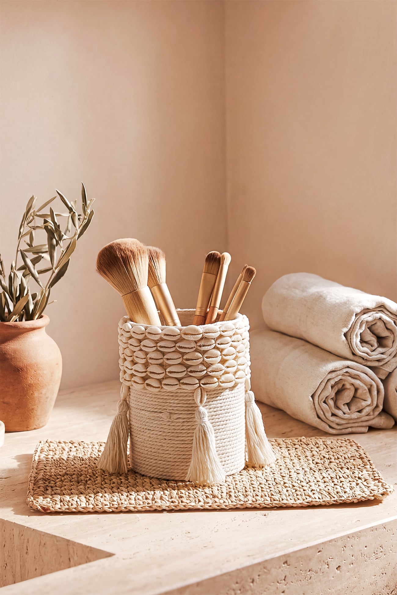 Ibizamode small handcrafted basket with shell details in bohemian bathroom interior