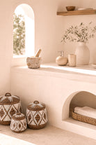 Ibizamode natural marble mortar and pestle with organic stone texture in bohemian interior