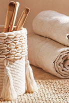 Ibizamode small handcrafted basket with shell details in bohemian bathroom interior