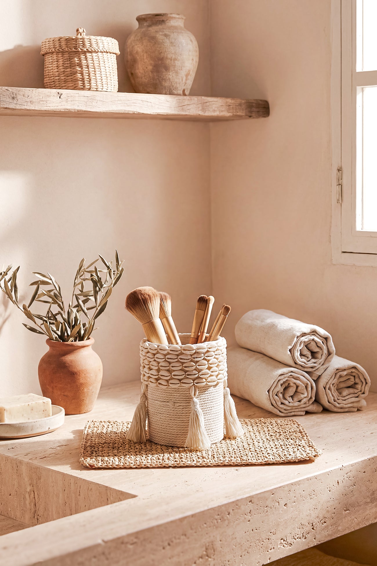 Ibizamode small handcrafted basket with shell details in bohemian bathroom interior