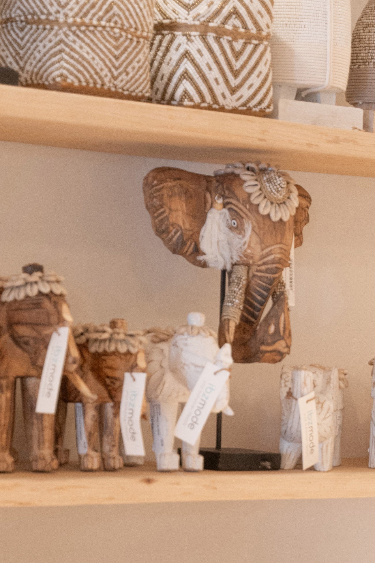 Ibizamode handcrafted wooden elephant decor with shells and tassels in bohemian interior