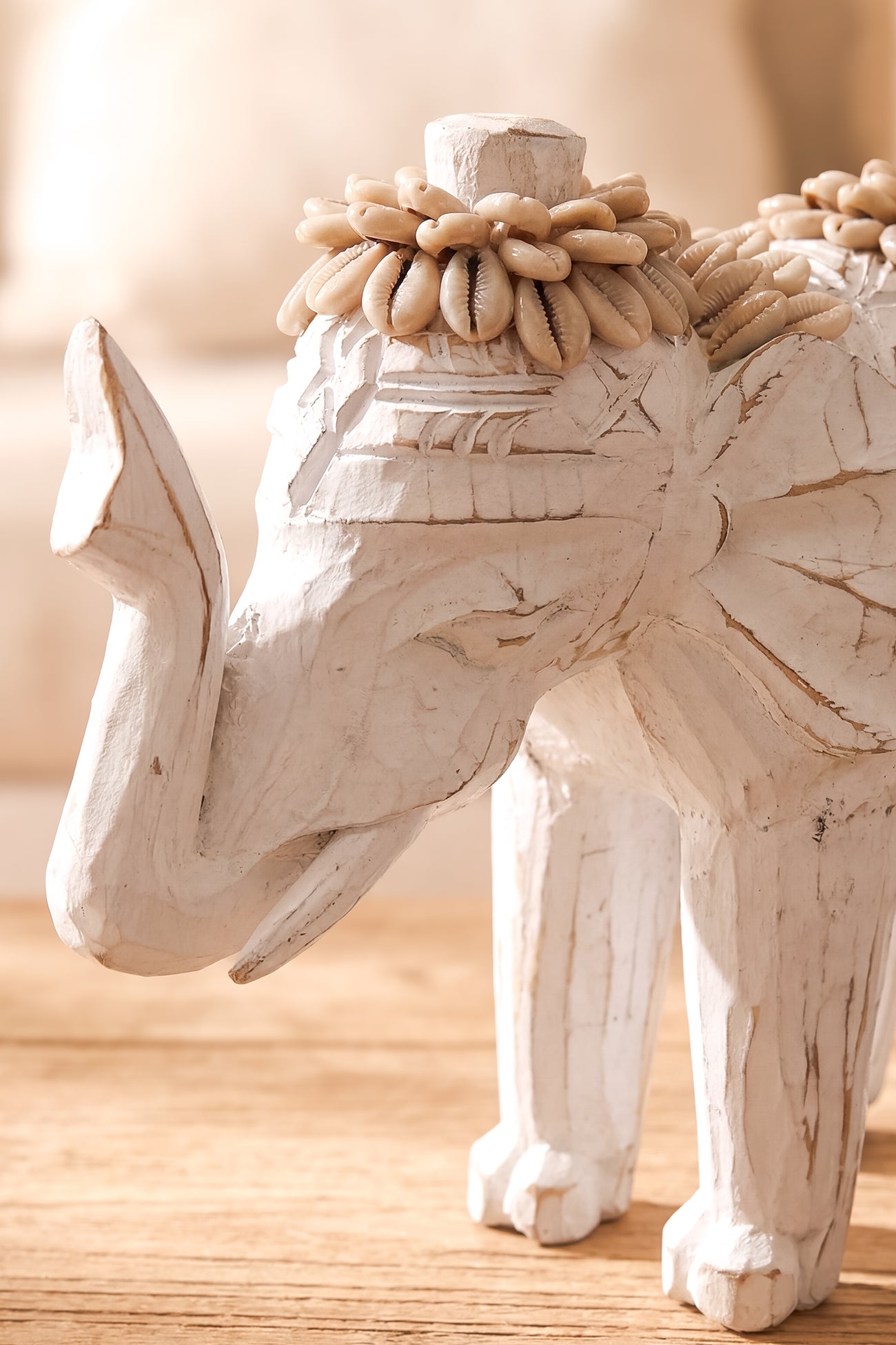 Ibizamode handcrafted white elephant decor with shell details in bohemian interior