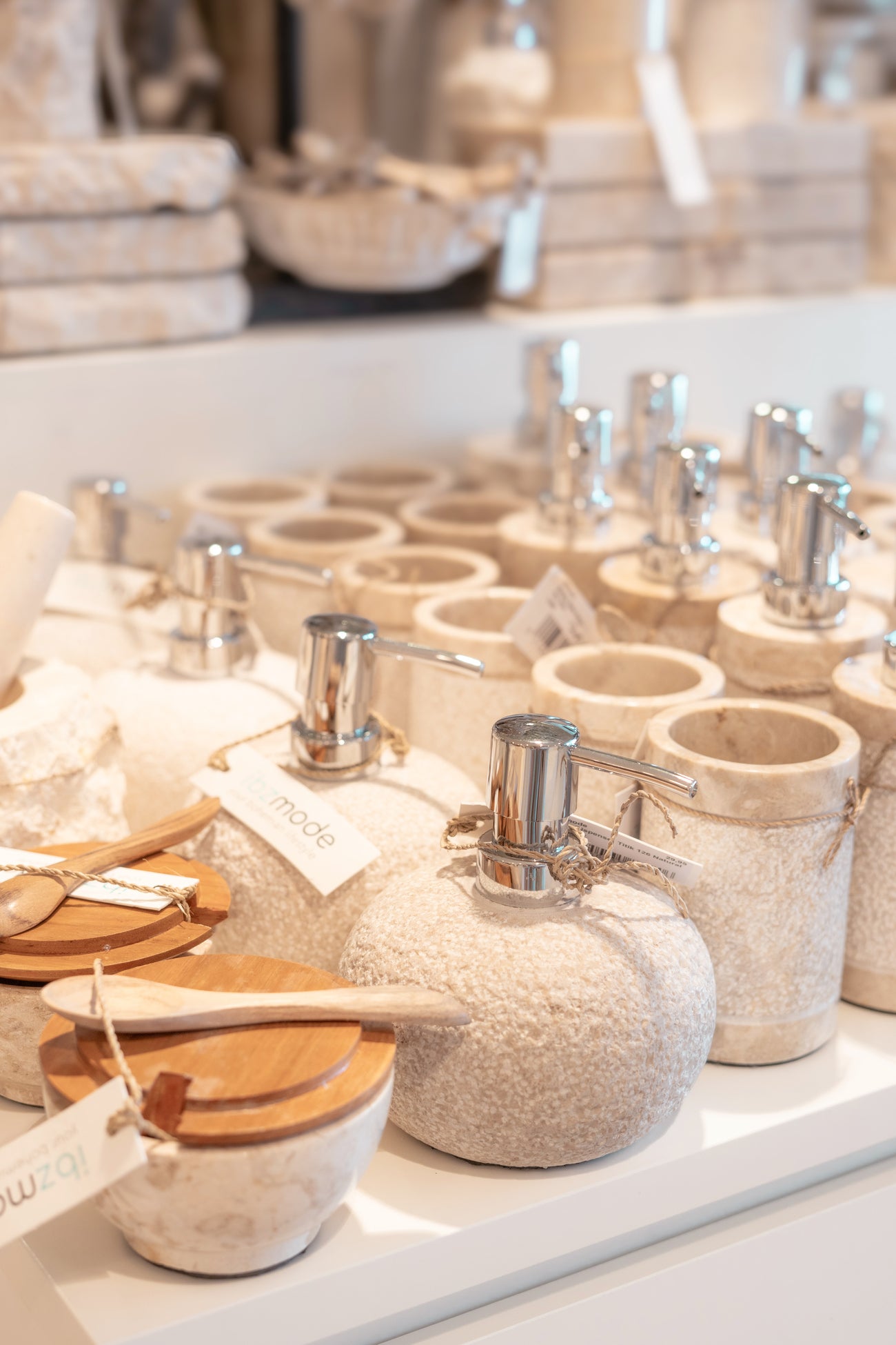 Ibizamode natural stone soap dispenser with textured finish in bohemian bathroom interior