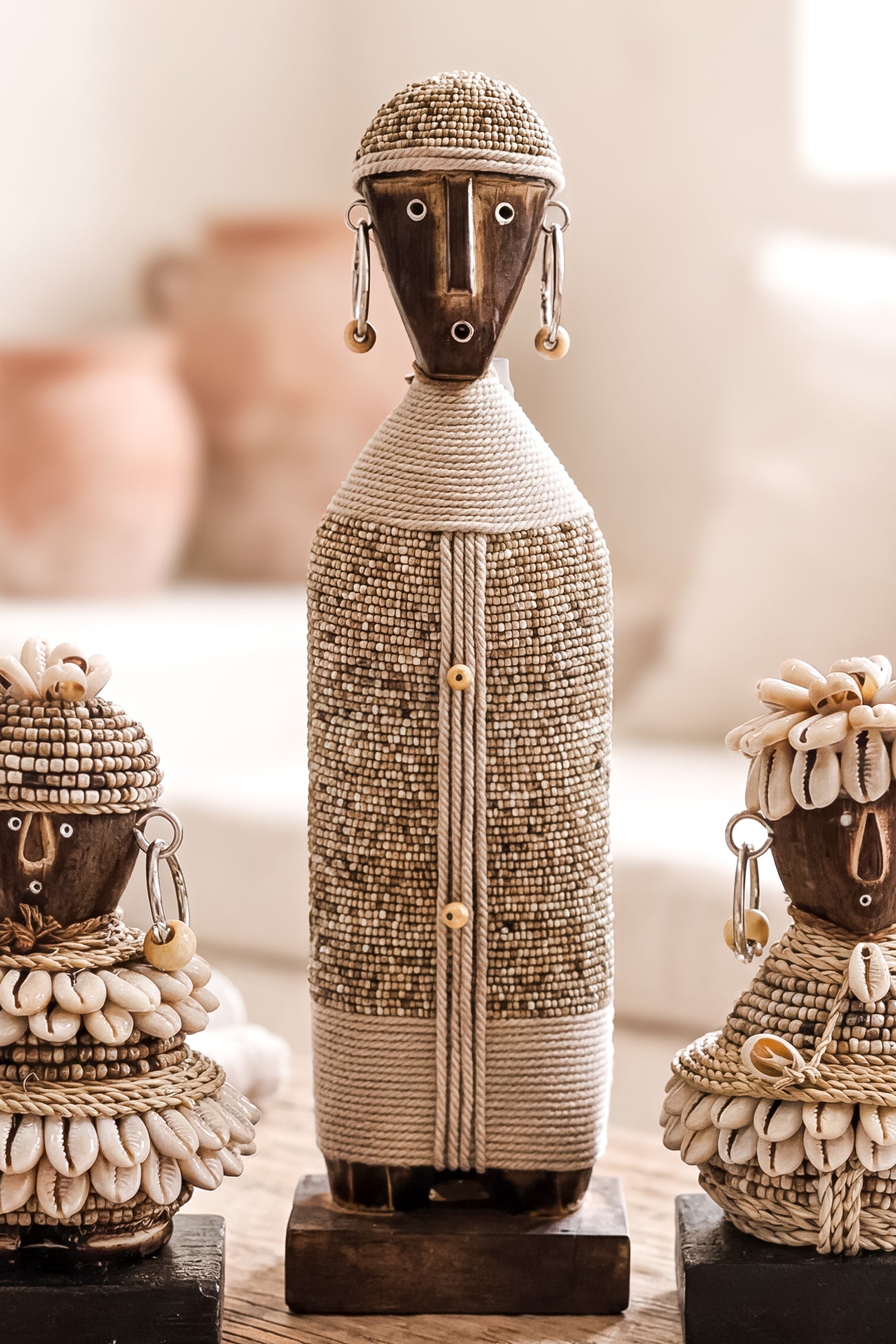 Ibizamode handcrafted nomad beaded doll in natural bohemian interior styling