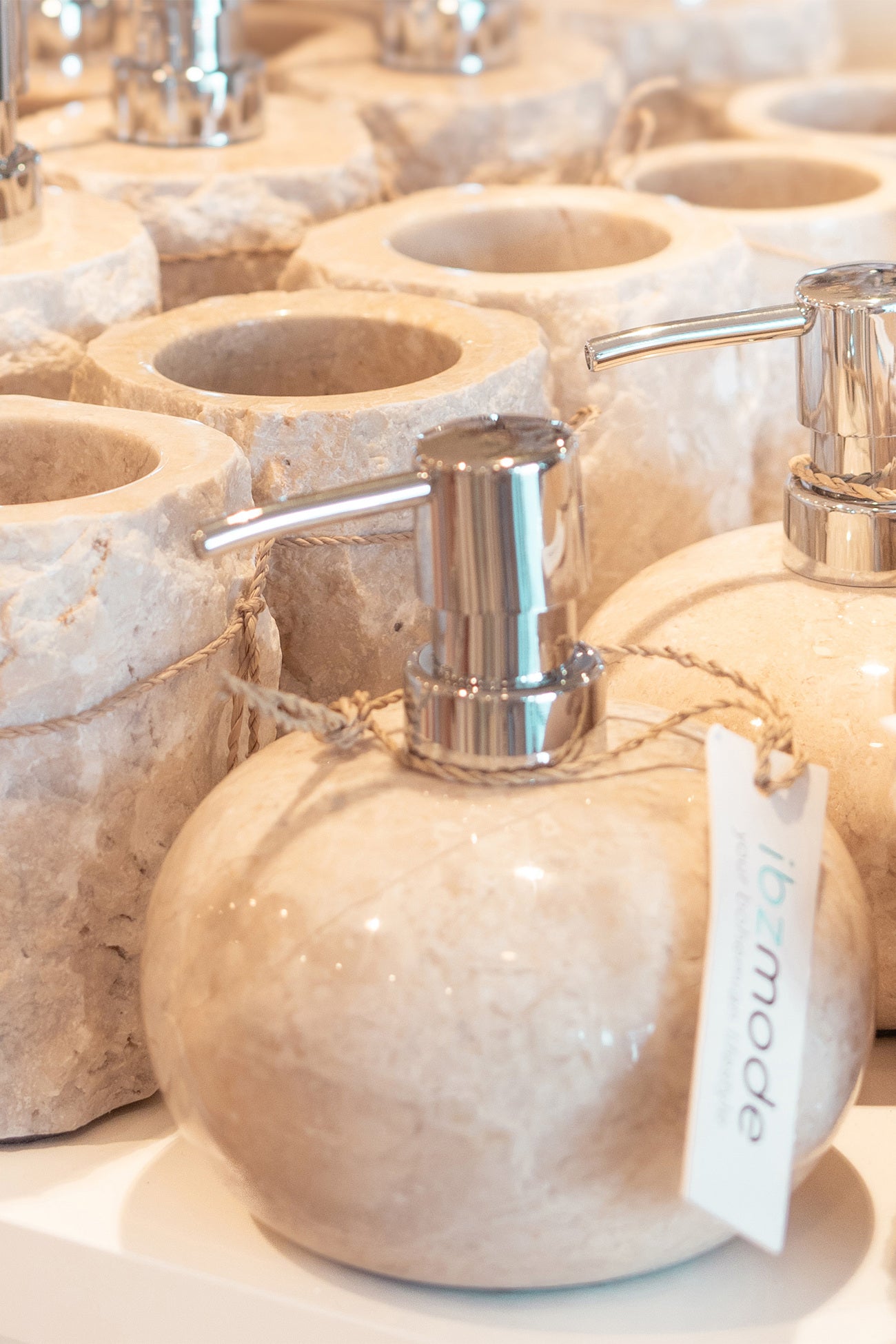 Ibizamode natural stone soap dispenser with silver pump in luxury bohemian bathroom interior