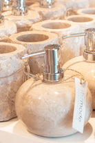 Ibizamode natural stone soap dispenser with silver pump in luxury bohemian bathroom interior