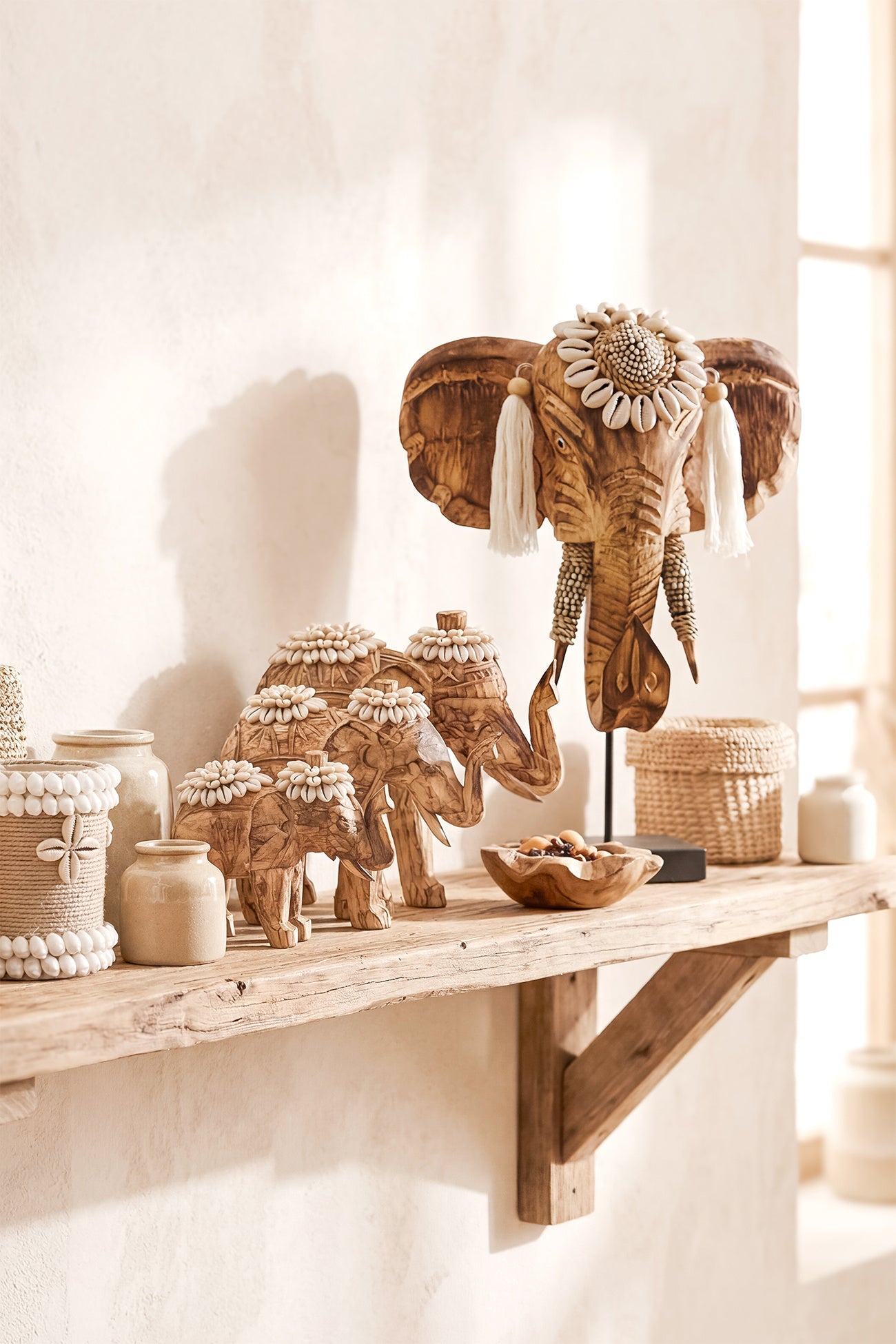 Ibizamode handcrafted wooden elephant decor with shells and tassels in bohemian interior