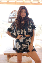 Ibizamode Bohemian Bloom black floral Ana top with lace and tassel neckline